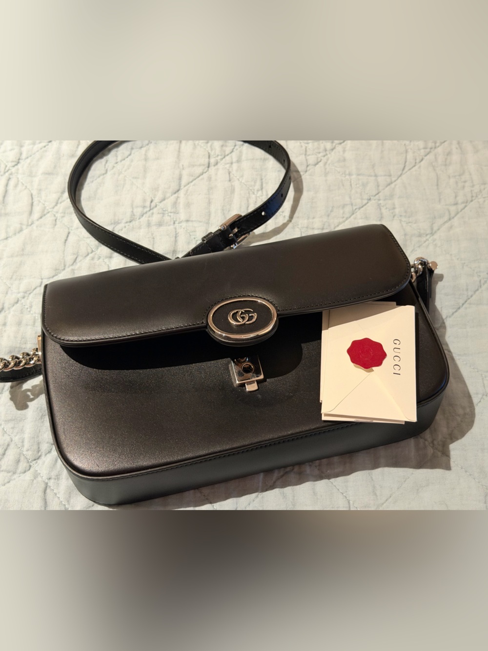 Black Gucci bag with crossbody strap